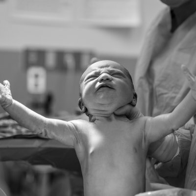 baby crying black and white photo